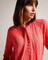 JULINAA-Tops-JULINAA is a lightweight, feminine layer that transitions easily from day to evening. This lightweight blouse pairs wonderfully with wide-leg trousers and heels for a polished office look—or switch it up for jeans and sandals on a sunny weekend getaway. Blouse Neck tie Looped rouleaux trim Long sleeved Button fastening Lightweight fabric Julia is 5'10" / 1.78m and wears Coral in a Ted size 1- Ted Baker Romania